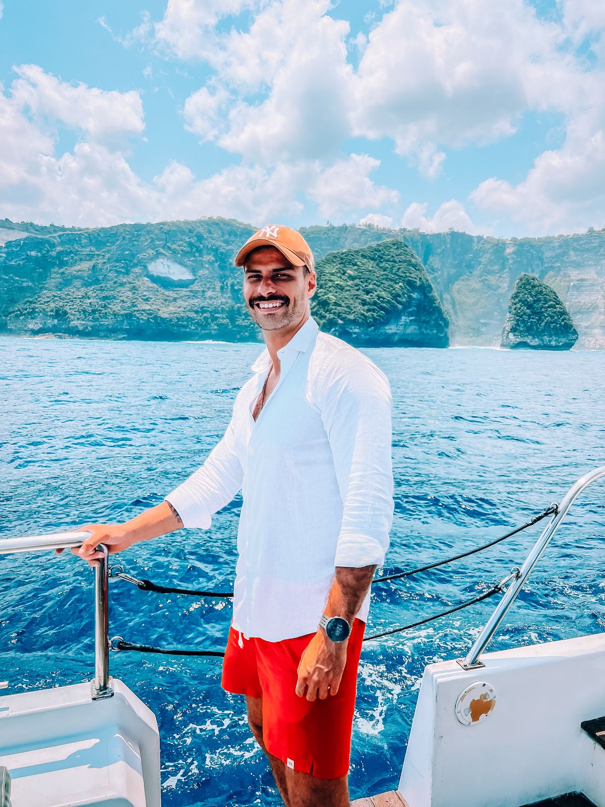 Guest relaxing on the deck of a private yacht in Bali