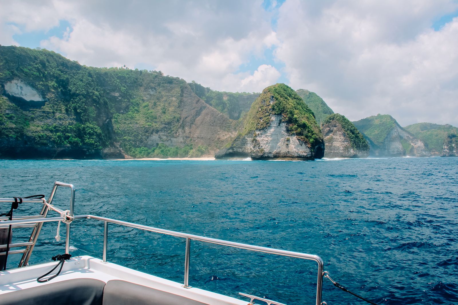 Dramatic Bali cliffs viewed from the yacht deck