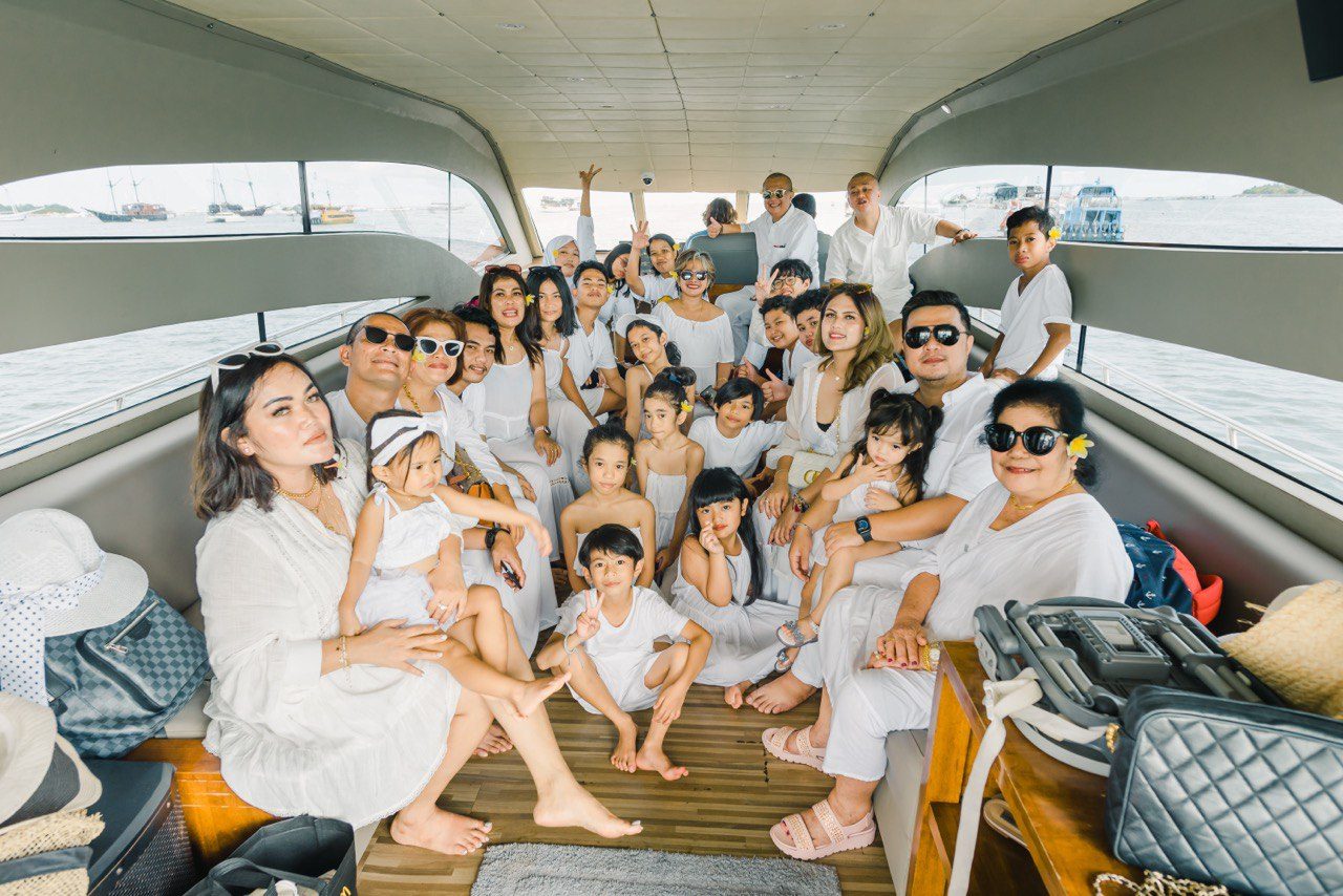 Family gathering on the yacht's shaded deck