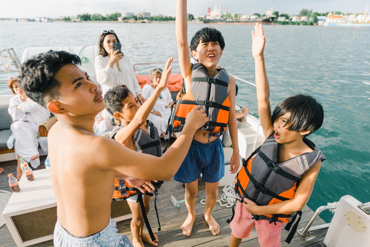 Young guests in life jackets ready to snorkel